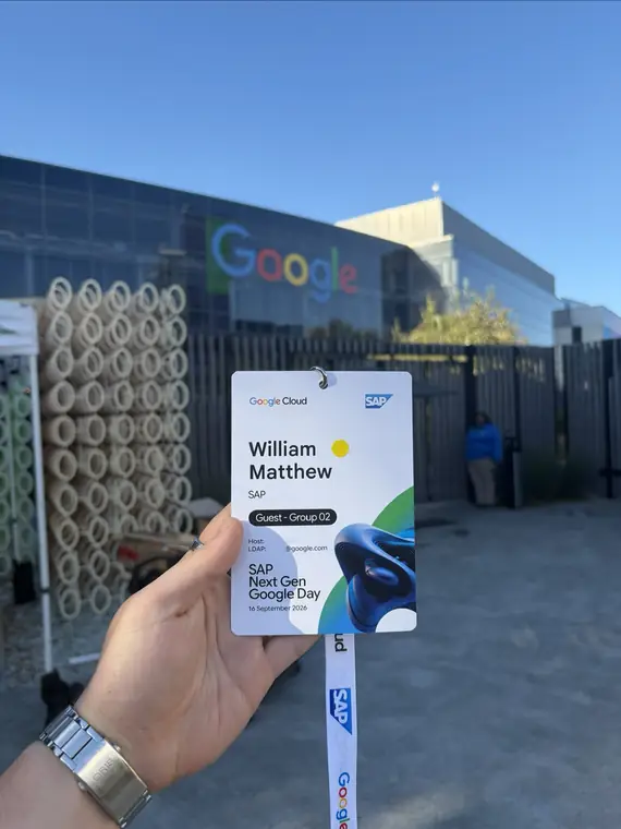 An SAP Next Gen Google Day visitor badge held up outside a Google office